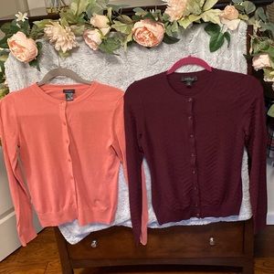 2 Ann Taylor cardigans in size extra small in salmon pink and burgundy.